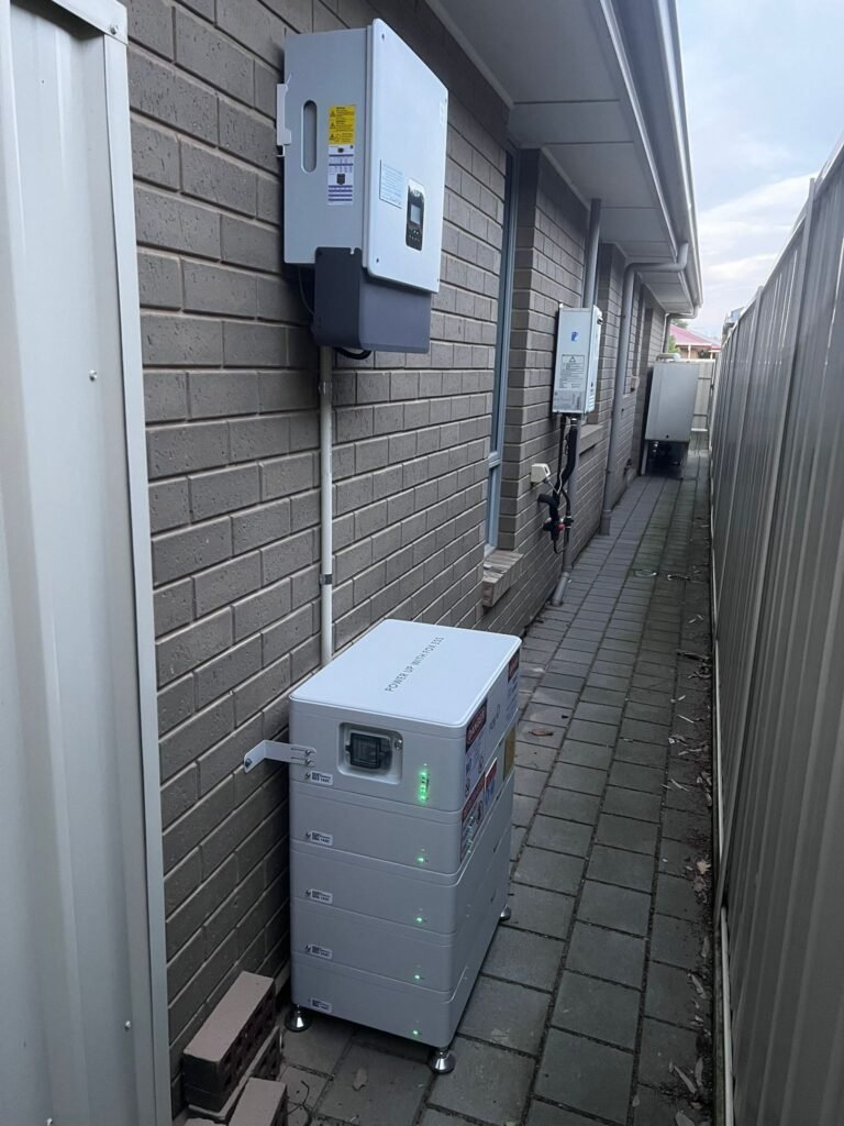 Inverter and battery in a side passage by Peace Electrical and Solar, battery installation in South Australia